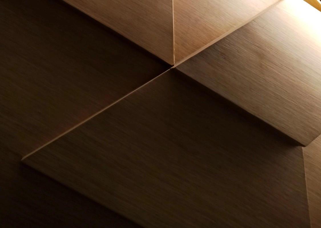 Premium interior wall design with layered wooden architectural elements. This represents the contact us background image
